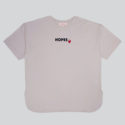 Product shot of the Hopesbrands women's oversized beige Cool Touch T-shirt with a black flocked Hopes logo and red heart on the chest, emphasizing comfort and breathability.