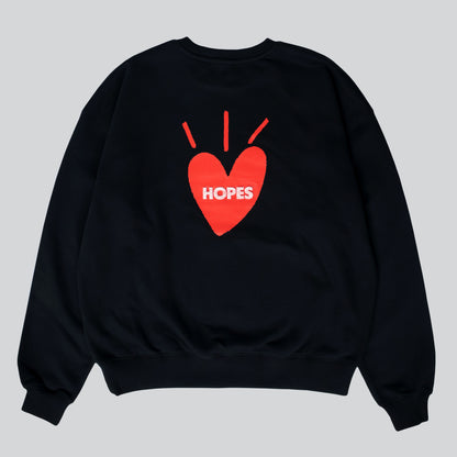 Big Heart crewneck sweatshirt in black with printed Big Heart logo and red-toned toothbrush embroidery on the back.