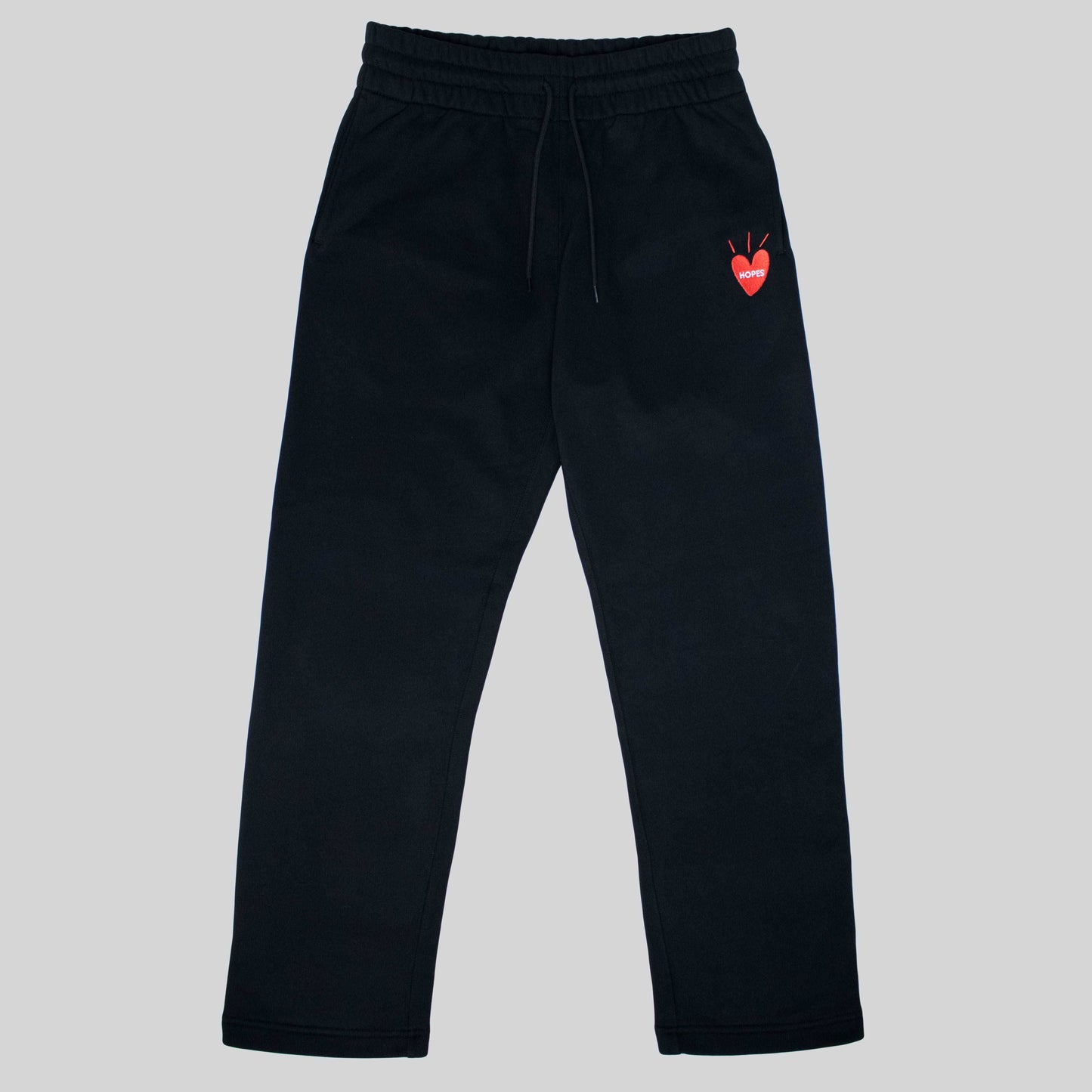 Product shot of Hopesbrands black Big Heart sweatpants, made from a cotton blend with an embroidered logo on the right thigh. Stylish and comfortable for everyday wear.