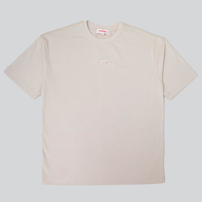 Product shot of Hopesbrands men's beige tonal short sleeve T-shirt with embroidered Hopes logo on the chest, offering comfort and timeless appeal.