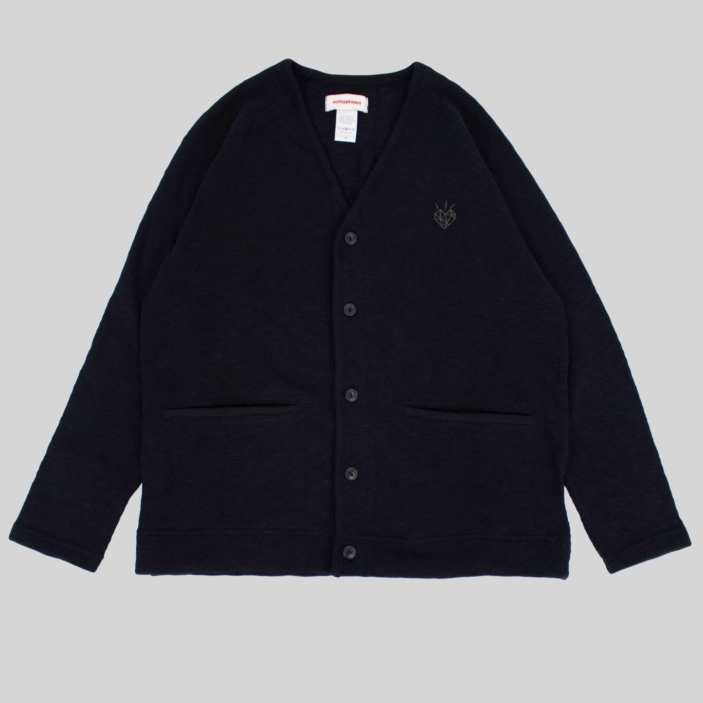 Hopes x Tieasy black cardigan with embroidered diamond heart logo, two pockets, and a comfortable fit.